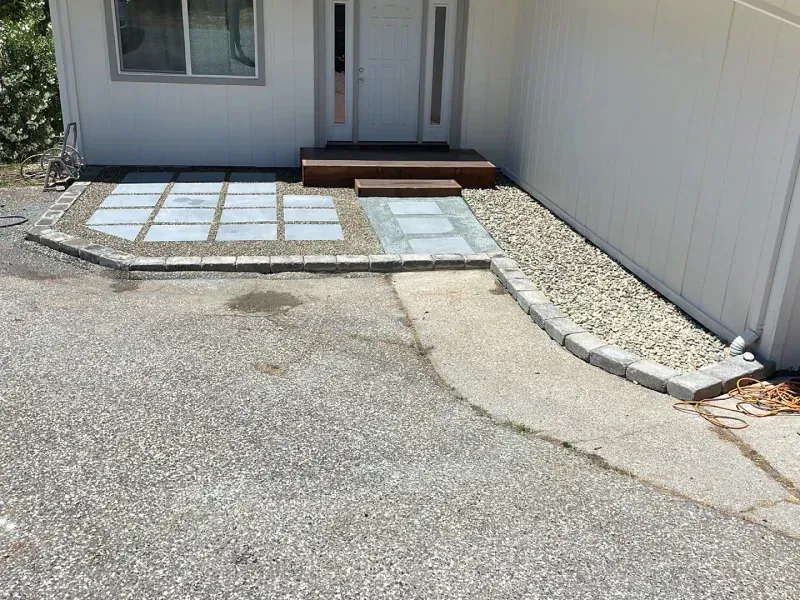 A house with a walkway leading to the front door