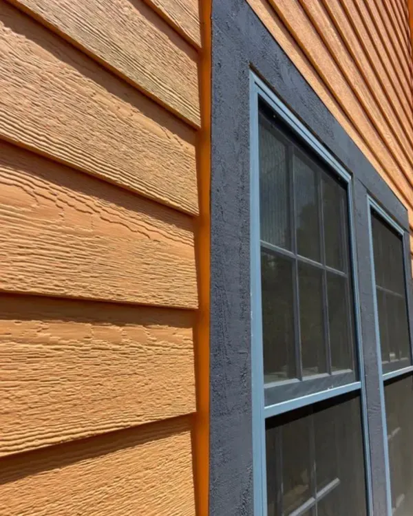 A close up of a window on the side of a house