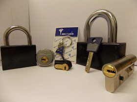 a selection of keys, padlocks and locks