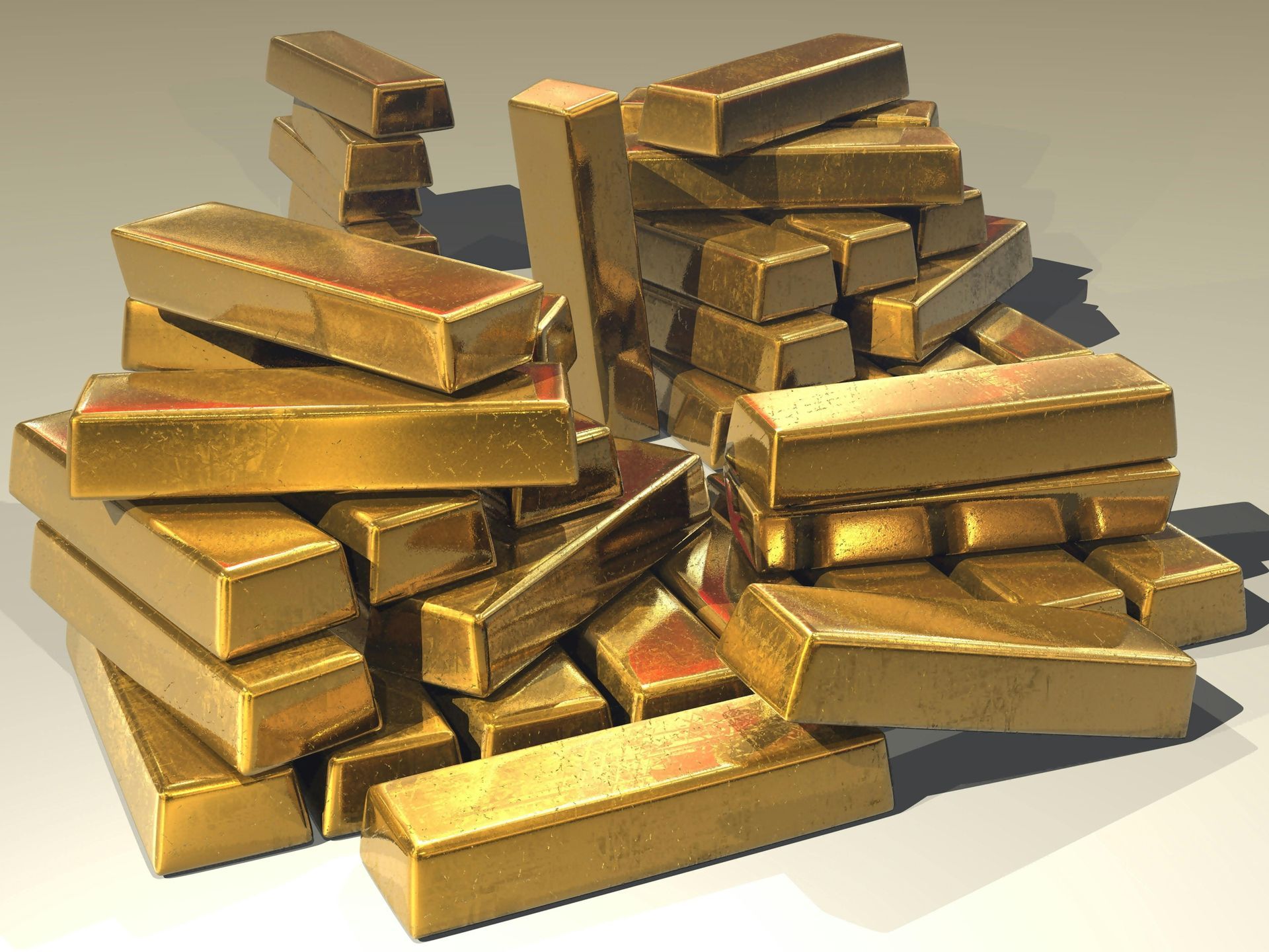 Ein Stapel übereinander gestapelter Goldbarren