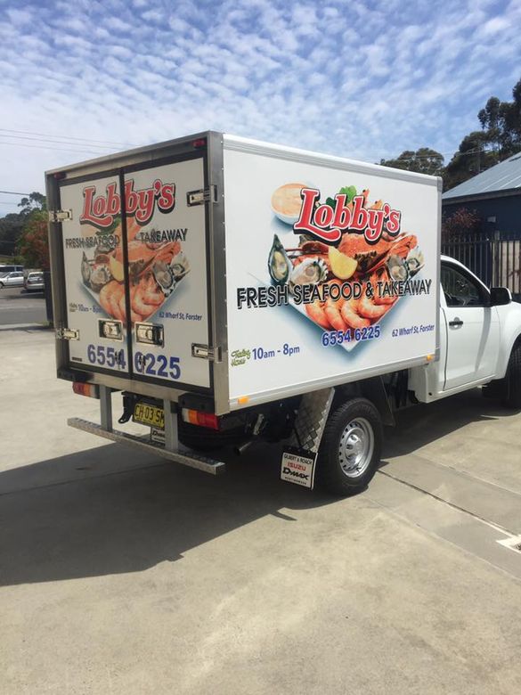Truck With Large Banner — Signage Maker in Tuncurry, NSW