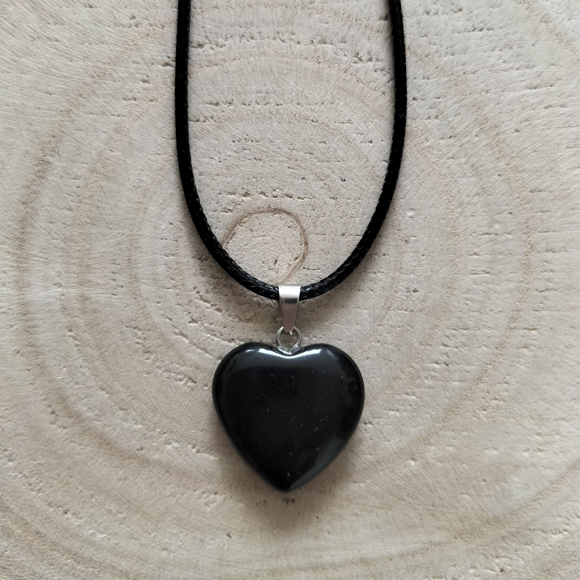 Waxkoord ketting met onyx hartje