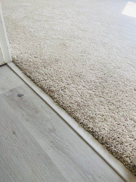 carpet transition to vinyl planks with transition piece in oceanside