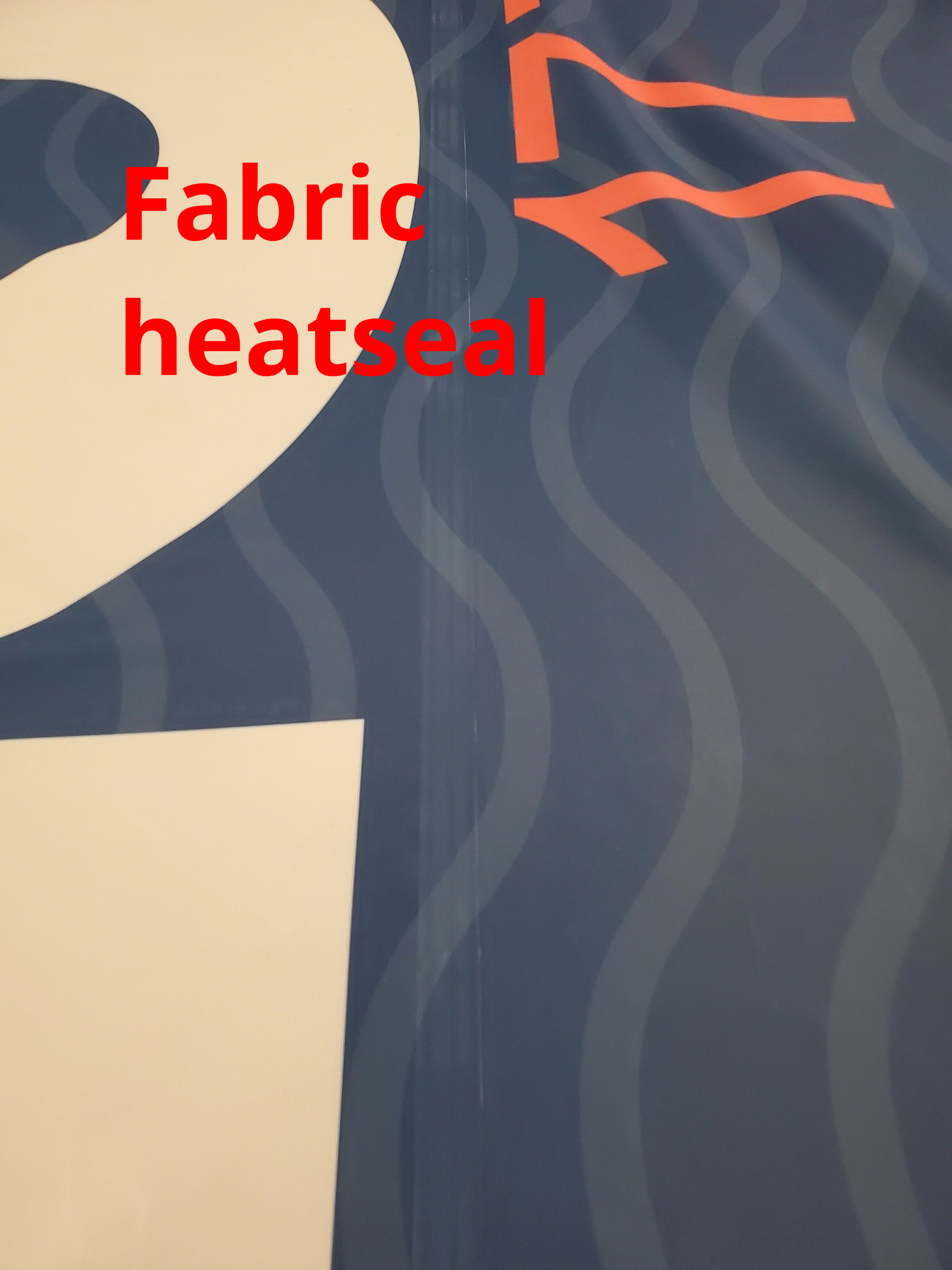 A close up of a fabric heat seal on a shirt