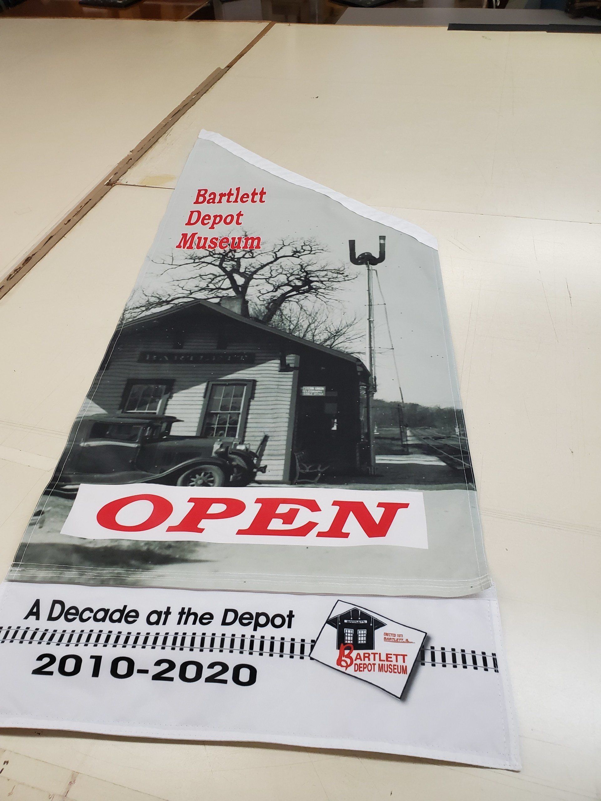 A poster that says open a decade of the depot 2010-2020