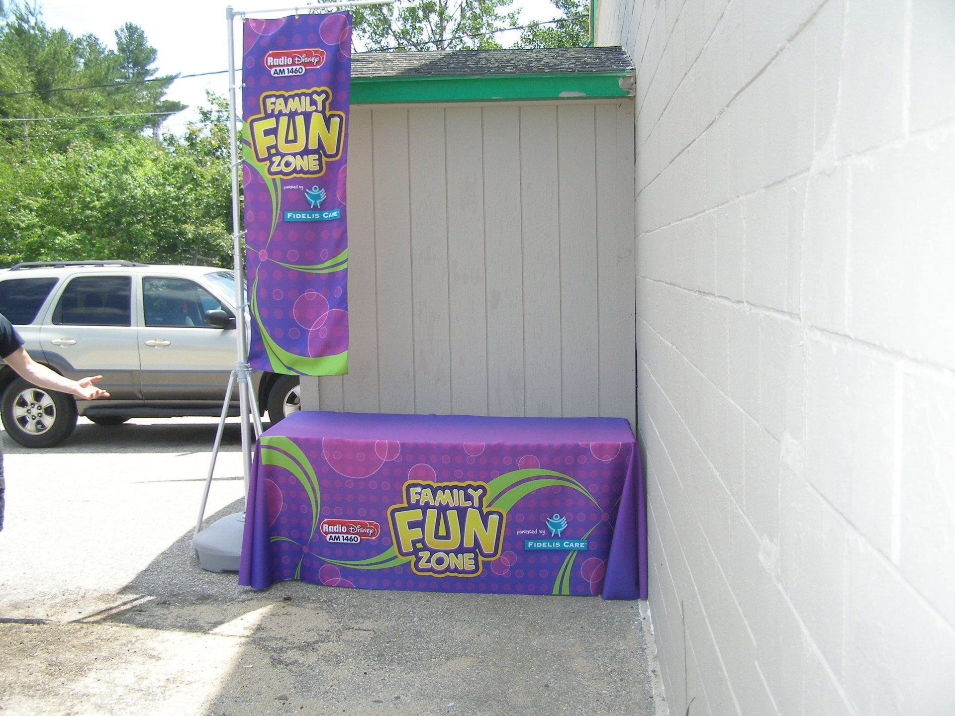 A purple table cloth that says really fun zone on it