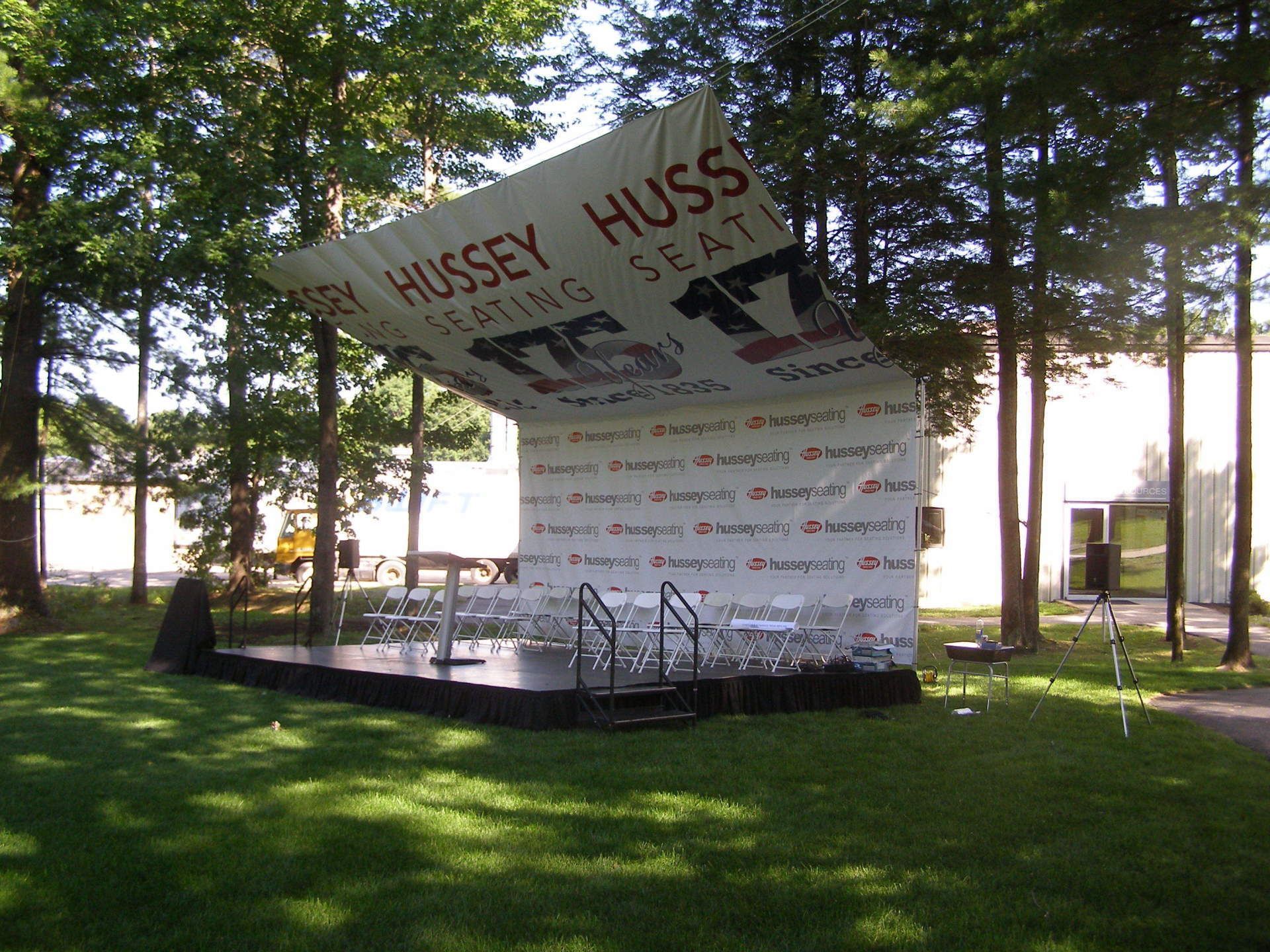 A stage with a banner that says hussey huss on it