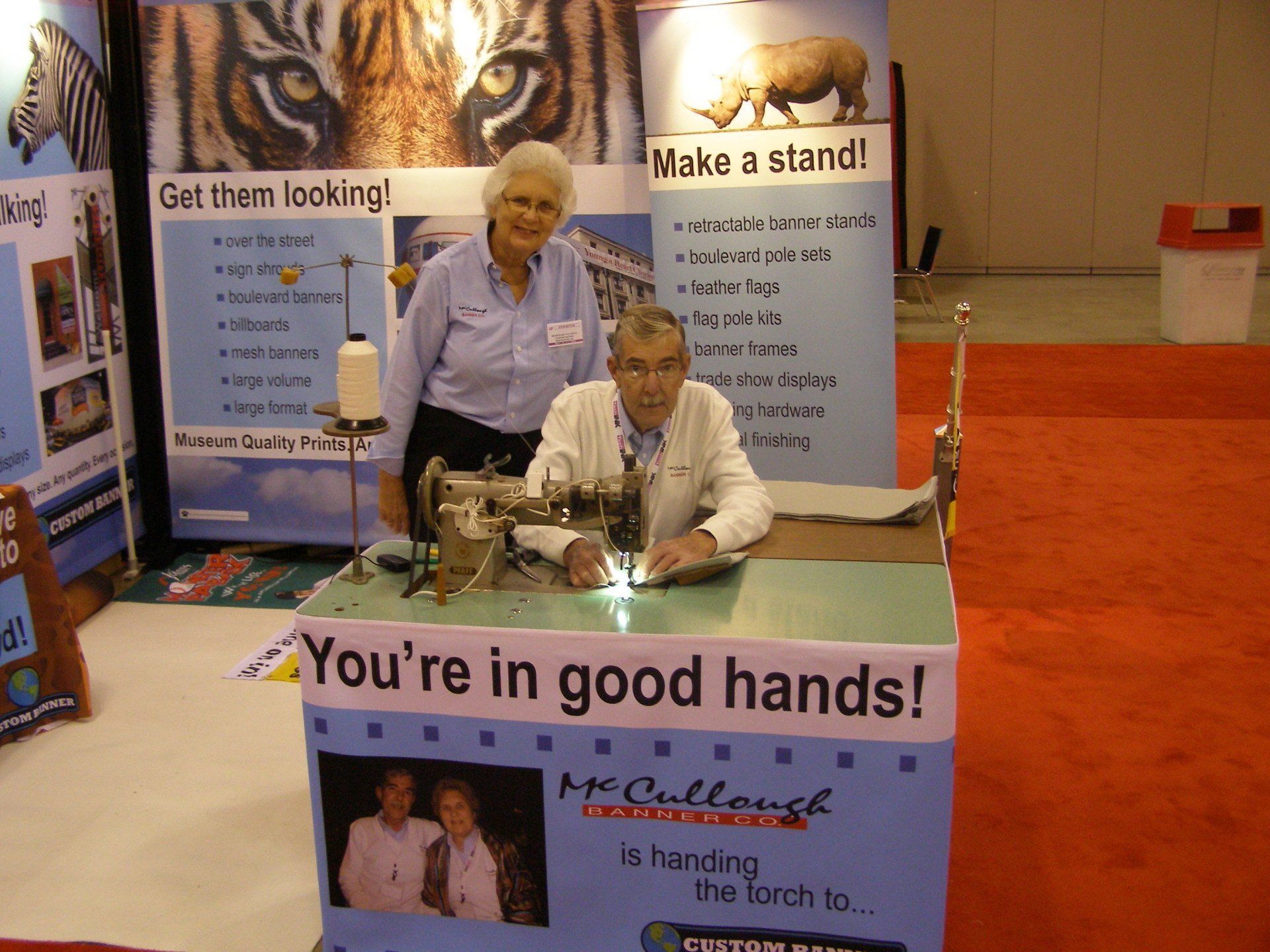 A man sitting at a table with a sign