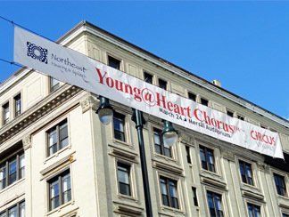 A large building with a banner hanging from the side