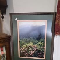 Framed landscape art of misty mountains, trees, and rhododendrons in green, blue, and pink hues.