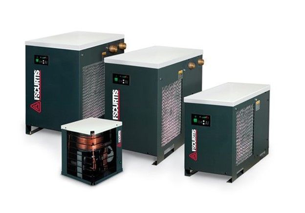 A group of air conditioners are sitting next to each other on a white background. A group of air conditioners are sitting next to each other on a white background.
