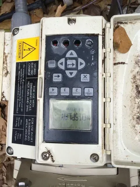 Control panel with buttons and screen, displaying 
