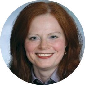 Smiling red-haired woman in a circular portrait against a light blue background
