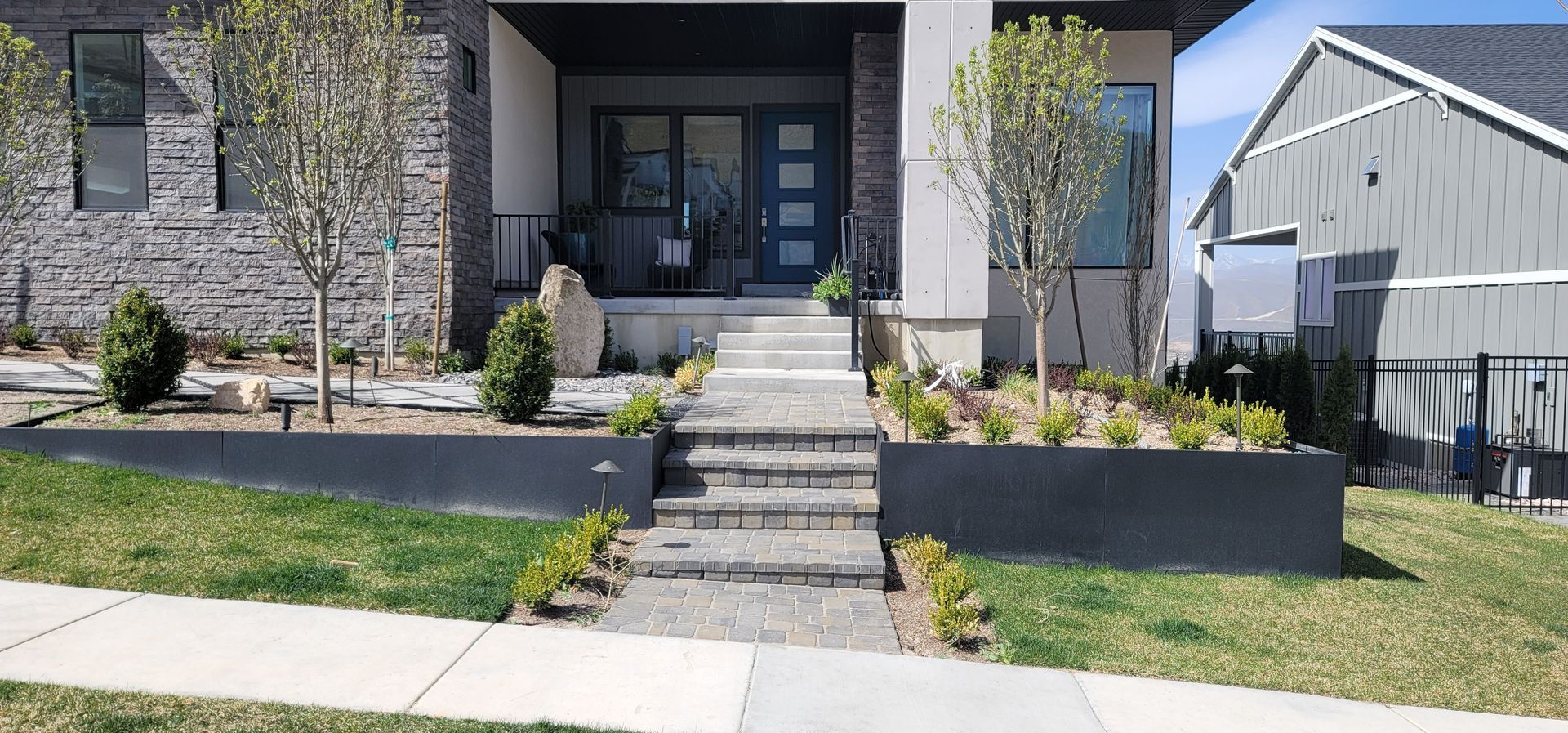 The front of a house with stairs leading up to it.