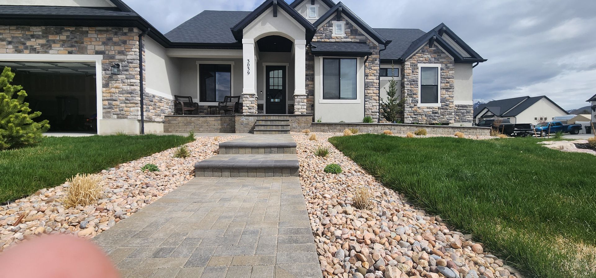 A large house with a walkway leading to it