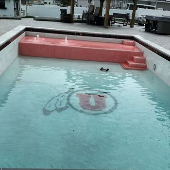 A swimming pool with a u on the bottom of it