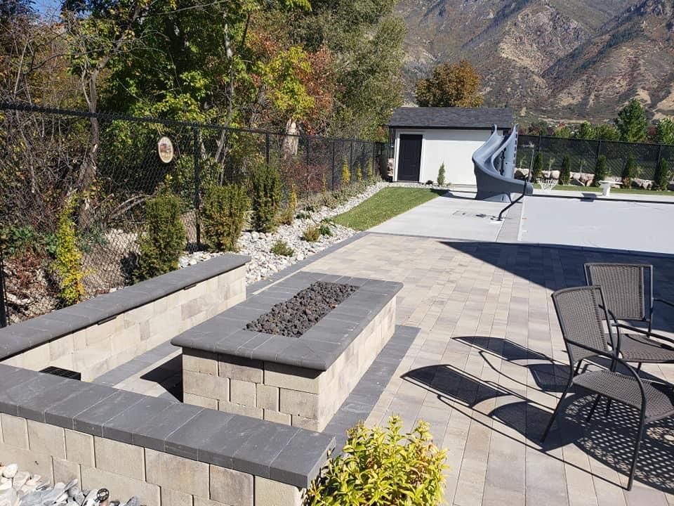 There is a fire pit in the middle of the patio.