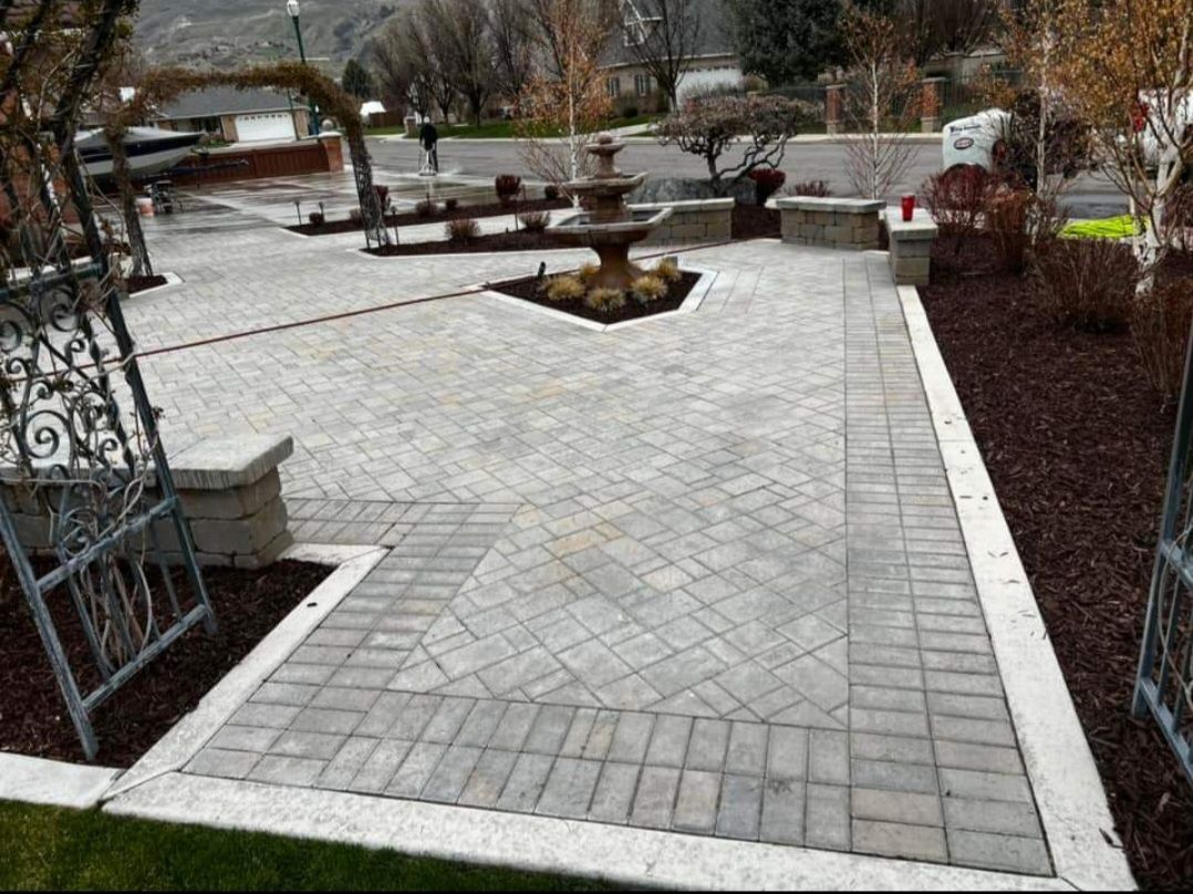 There is a fountain in the middle of the patio.