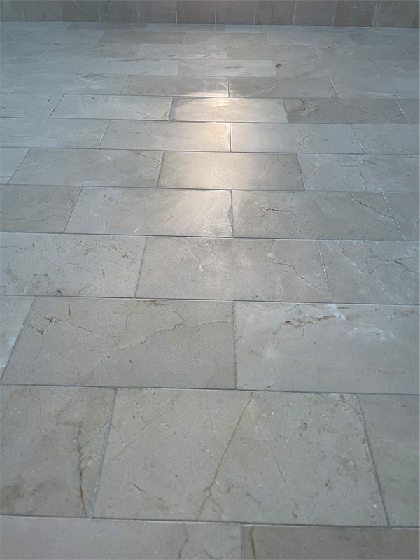 The sun is shining through the tiles on the floor