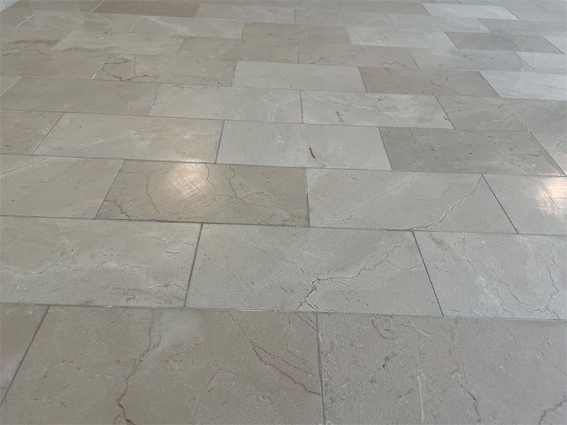 A close up of a tiled floor in a room.