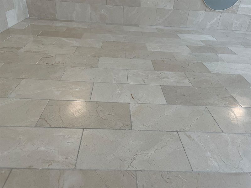 A close up of a tiled floor in a room.