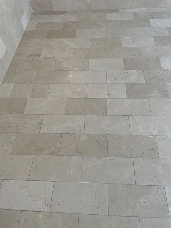 A close up of a tiled floor in a room.