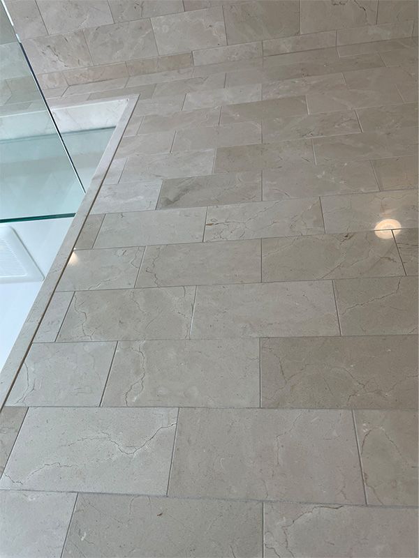 A close up of a tiled floor in a bathroom.