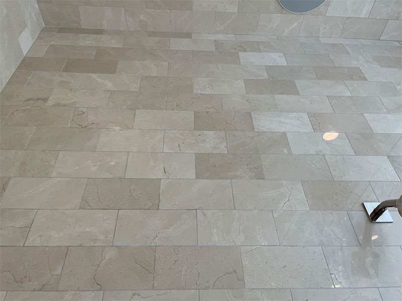 A close up of a tiled floor in a room.