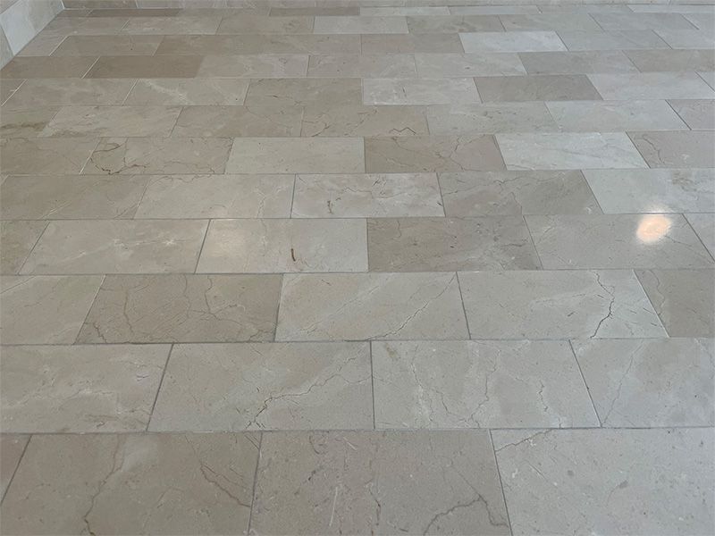 A close up of a tiled floor in a room.