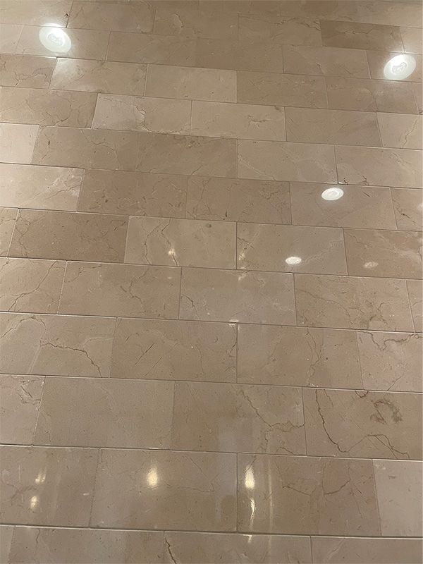 A close up of a marble floor with a lot of tiles on it.