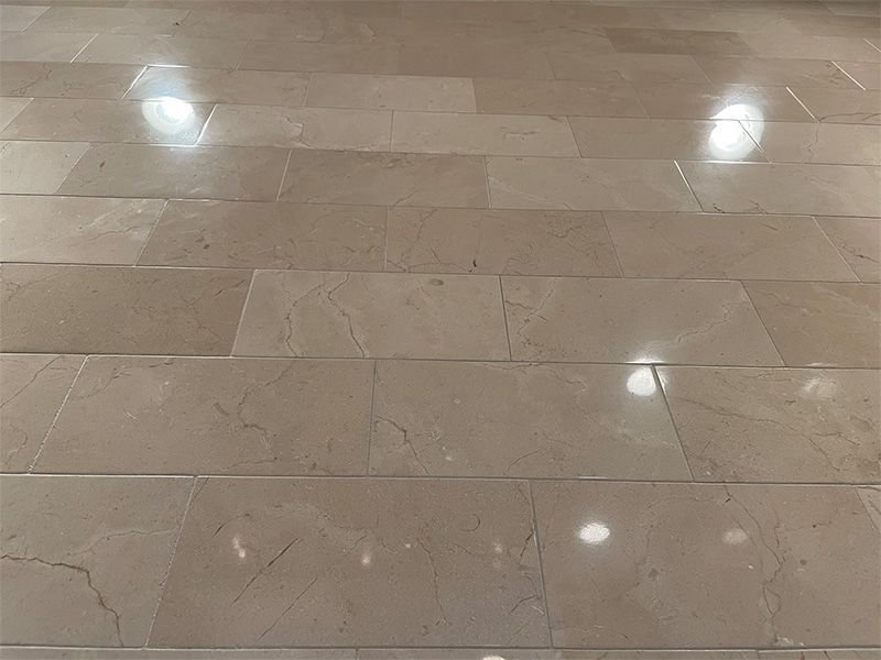 A close up of a marble floor with a lot of tiles on it.