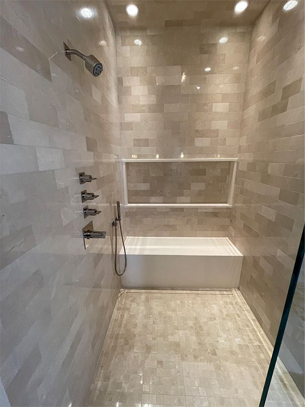 A bathroom with a bathtub and a shower.