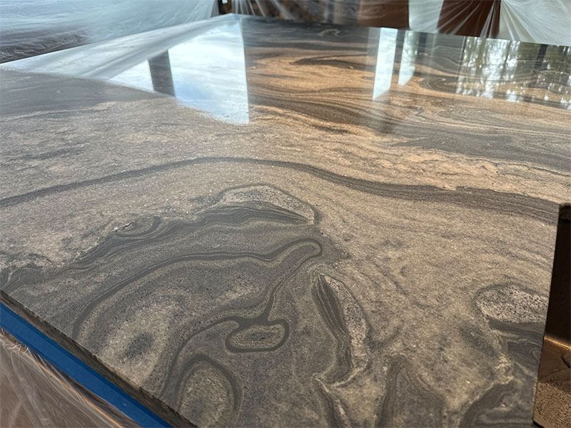 A close up of a marble counter top with a swirl pattern.