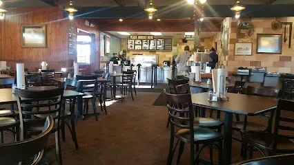 A restaurant with a lot of tables and chairs