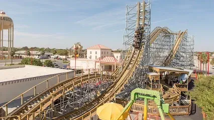 An aerial view of a roller coaster at an amusement park.