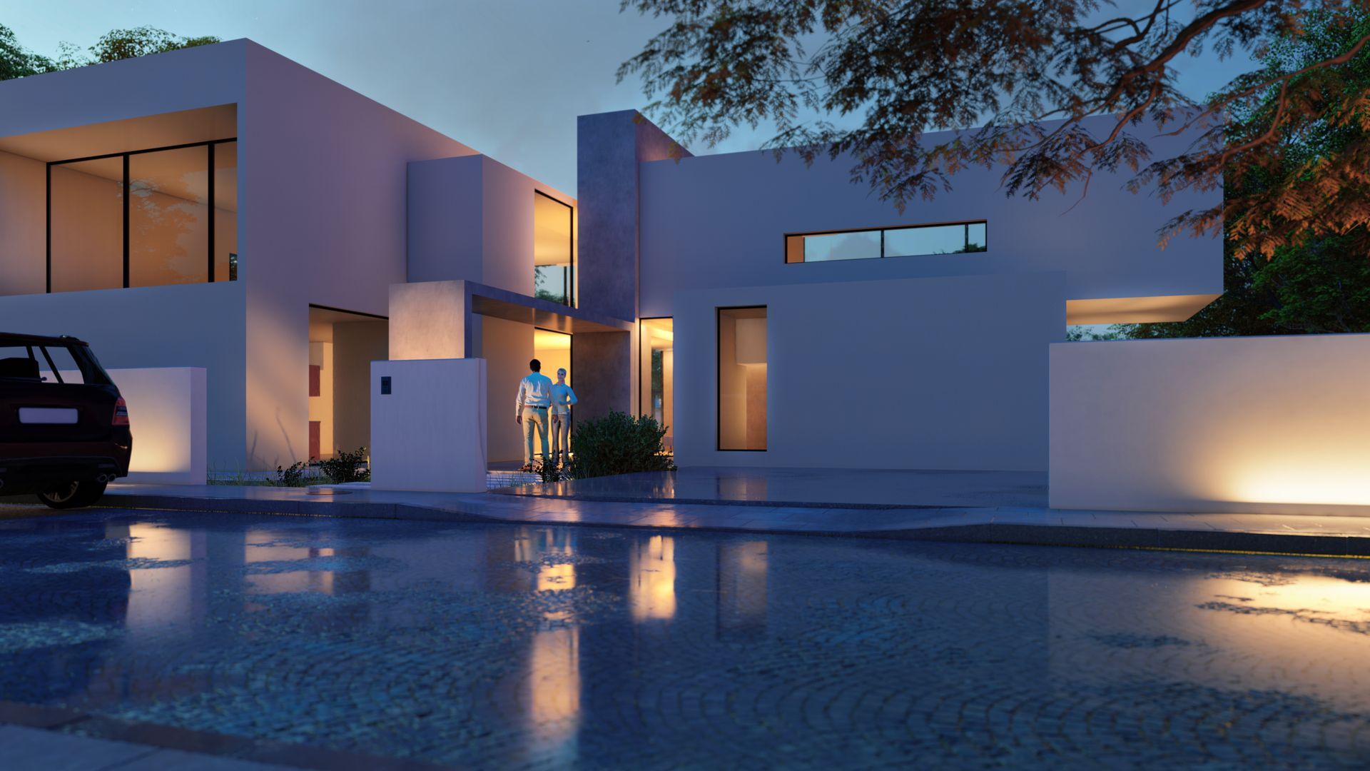 Modern white house with reflecting wet street, illuminated at dusk.