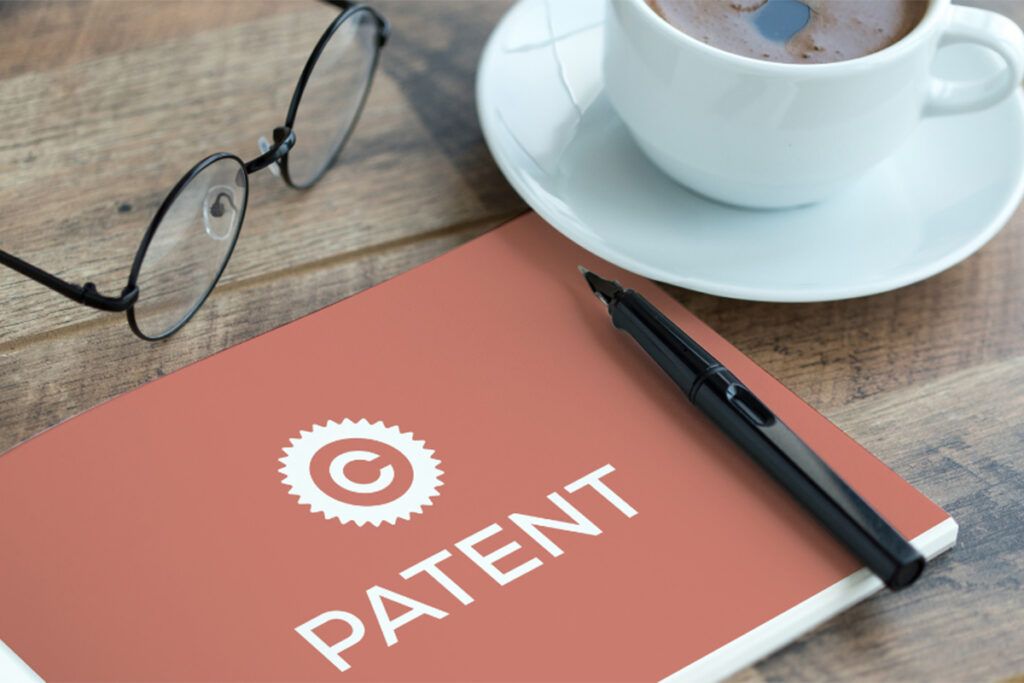 A notebook with the word patent written on it