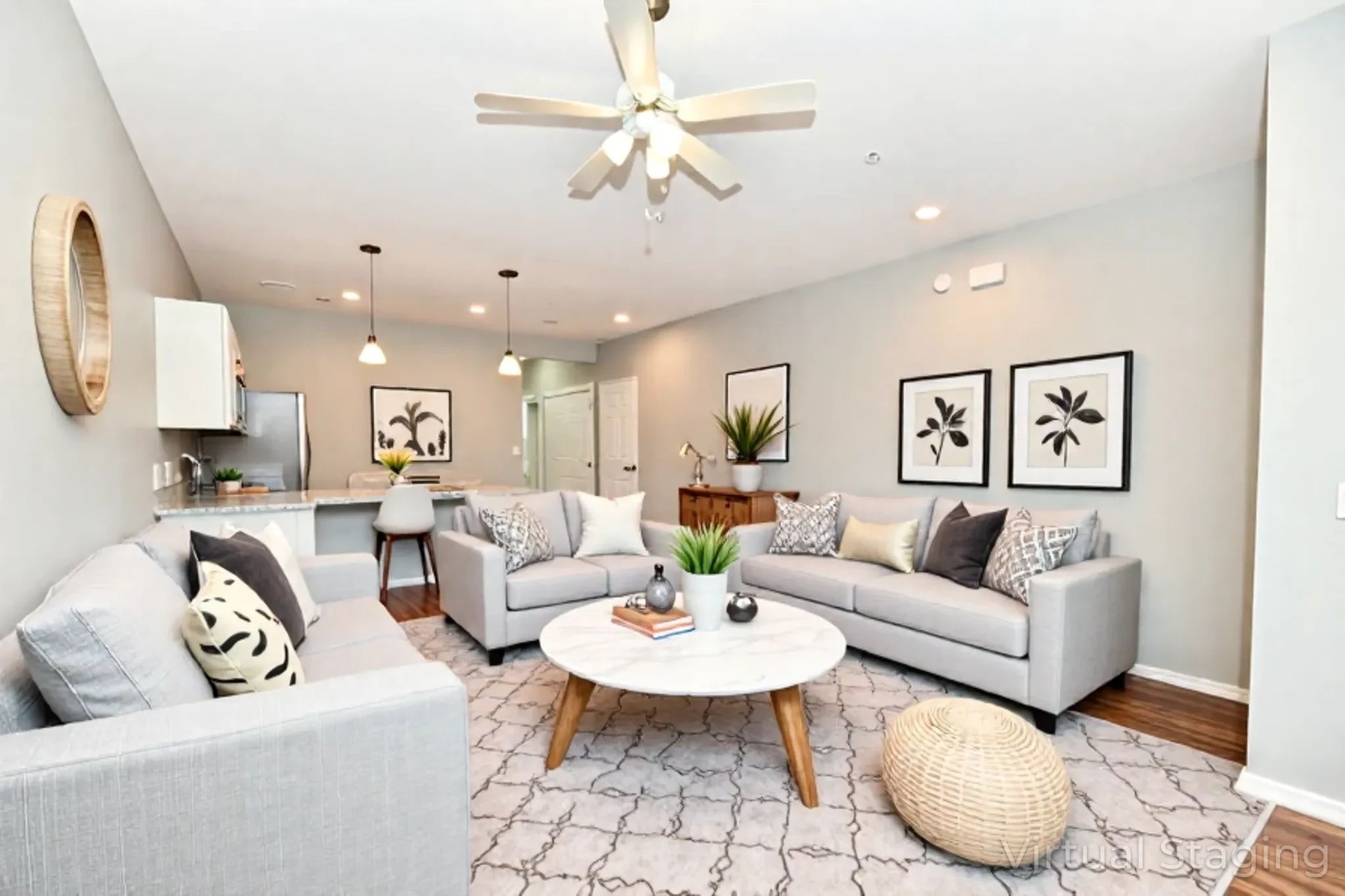 A living room with two green chairs and a table