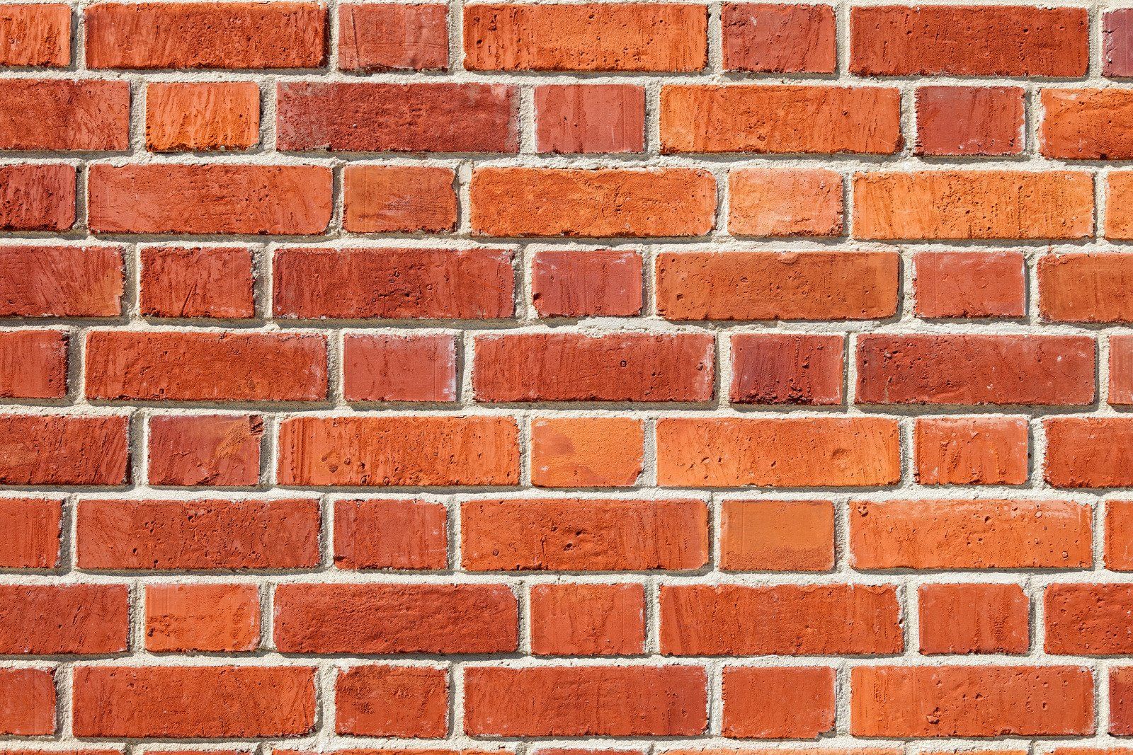 Red brick wall with mortar.