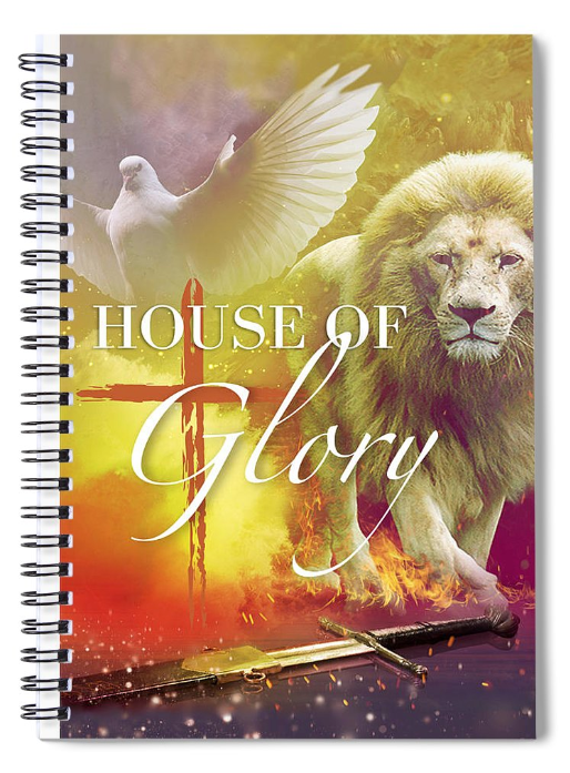 A spiral notebook with a lion and a cross on the cover