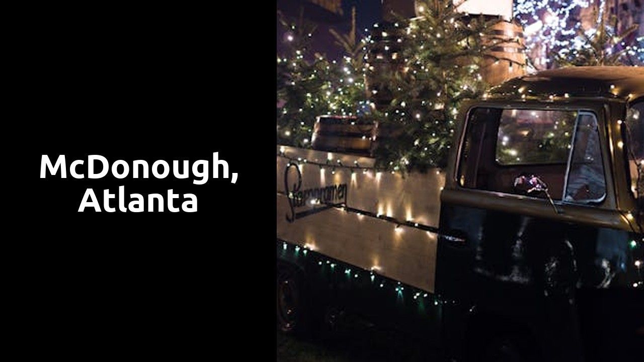 A truck is decorated with Christmas lights and a Christmas tree in the back.