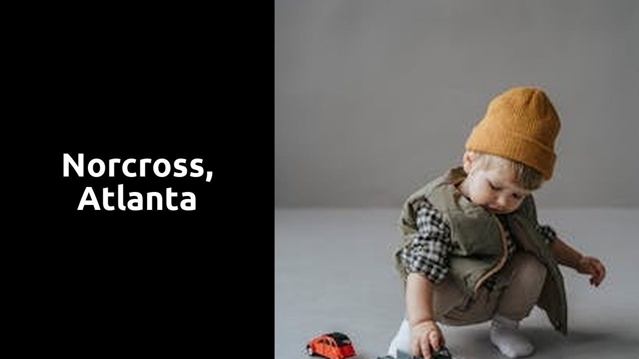 A little boy is kneeling down playing with a toy car.