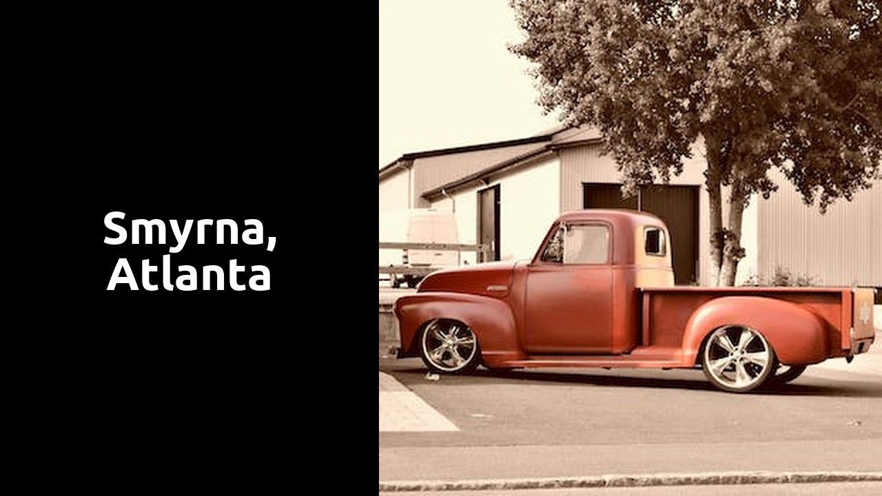 A red truck is parked on the side of the road in Atlanta