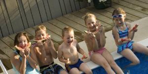 Pool Fence and Happy Kids — Hinesville, GA — Hinesville Fence EBG LLC