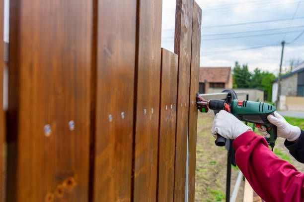Installing a Wooden Fence With a Drill — Hinesville, GA — Hinesville Fence EBG LLC