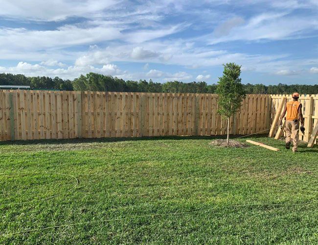 Installing Wooden Fence — Hinesville, GA — Hinesville Fence EBG LLC