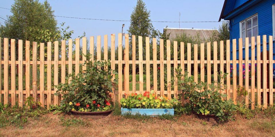 A Wooden Fence With Flowers — Hinesville, GA — Hinesville Fence EBG LLC