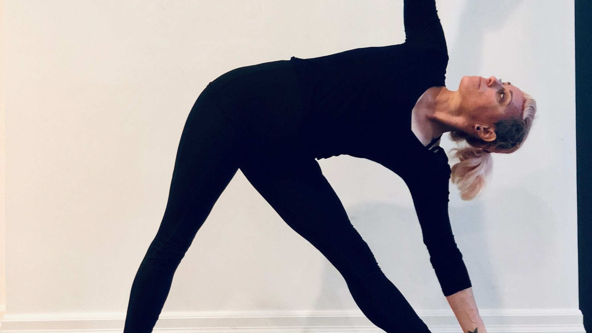 woman with good posture doing triangle pose