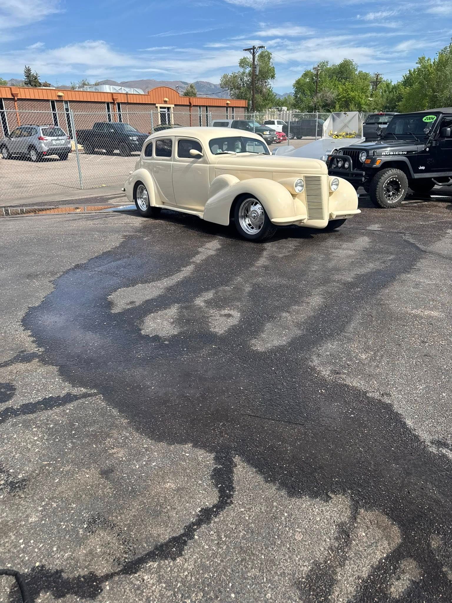 Dirty White Car Outside of Shop | Castle Automotive Repair Service