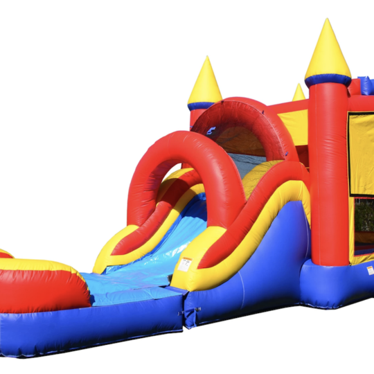 A red and blue bouncy house with a water slide